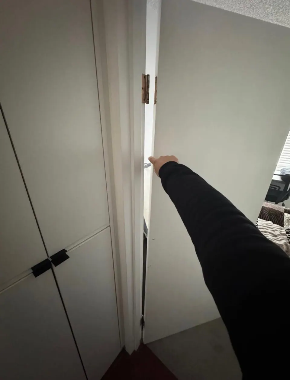 Earlier: Door standing open at the hinge side before the hinges were replaced
