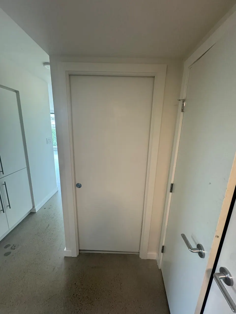 Completed: Hallway pocket door closed and sitting flush after the repair