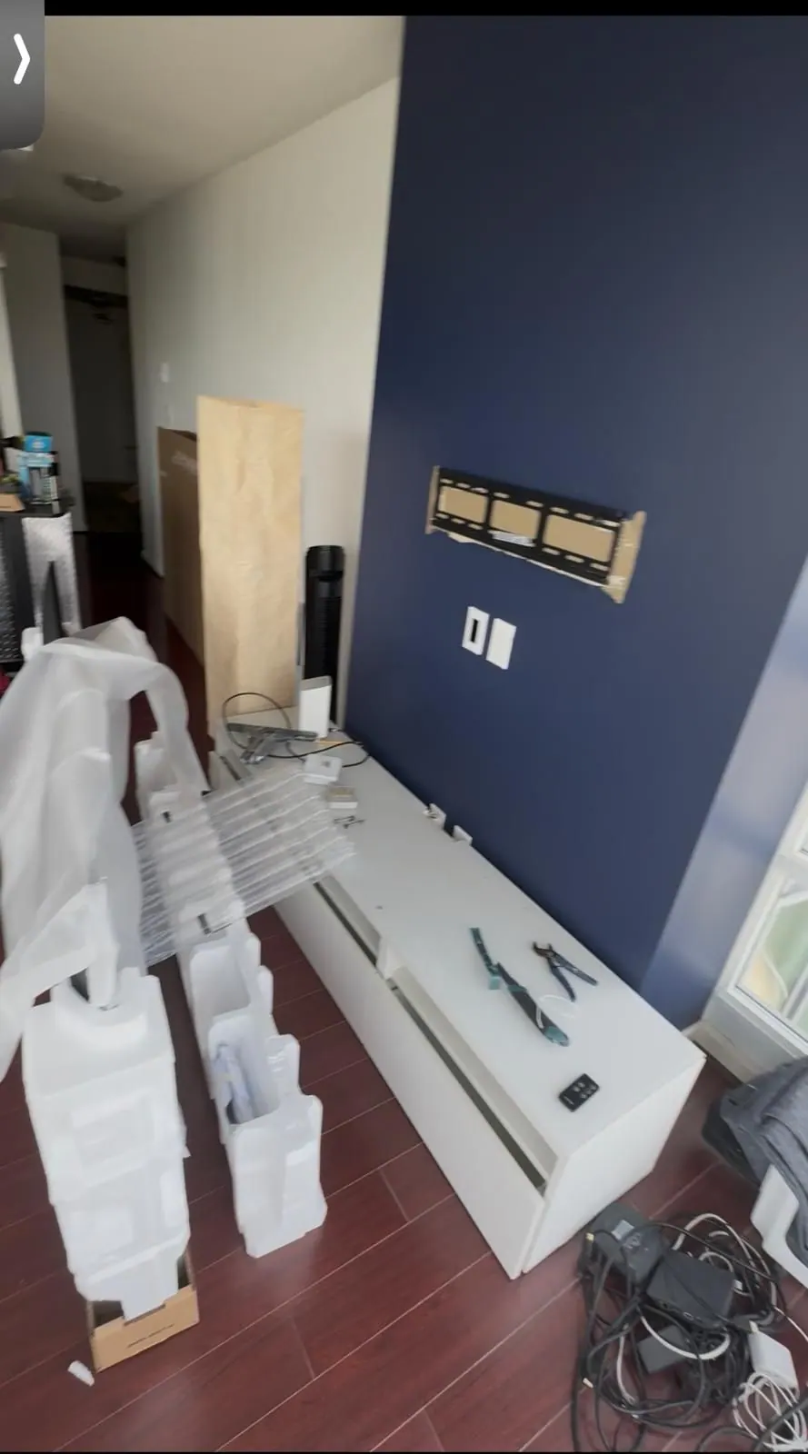 Earlier: Feature wall with the mounting bracket in place and the TV unit still being unpacked